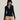 she is wearing a black bustier ribbed T-shirt, Chanel Choker as a necklace, and ribbed flared leggings in beige colour
